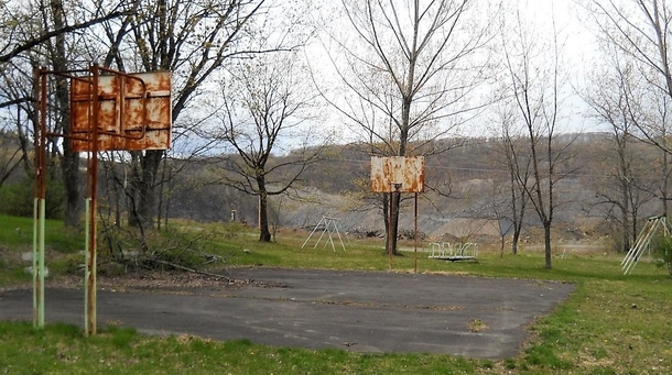 Abandon playground Wadesville PA coal strip pit in background that displaced town of Wadesville  x