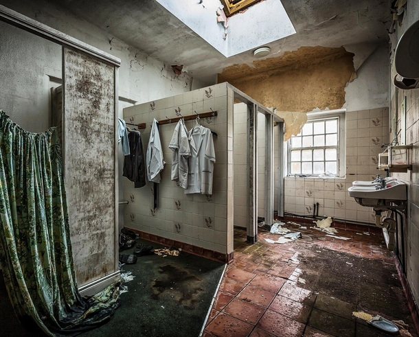 Abandoned bathroom with nurses uniforms remaining in St Brigids psychiatric hospital Ireland