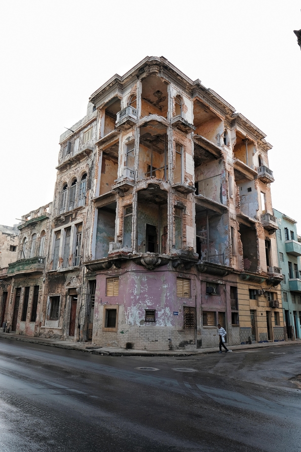 Abandoned building sits weathering on a corner in Havana Cuba 