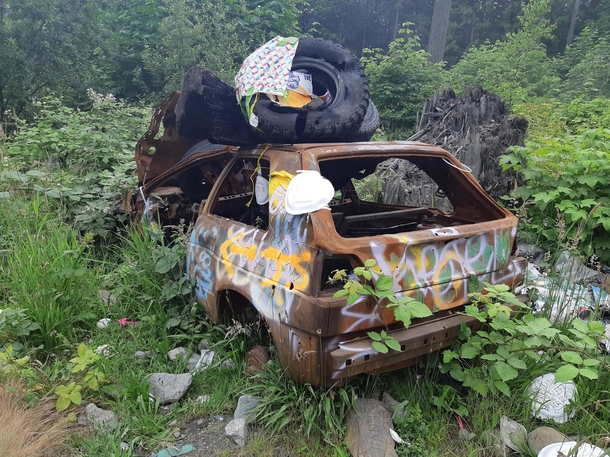 Abandoned car graffitied and littered in Harrison hot springs BC