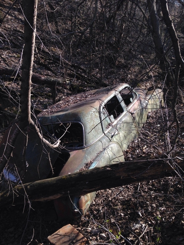 Abandoned car in a creek bed 