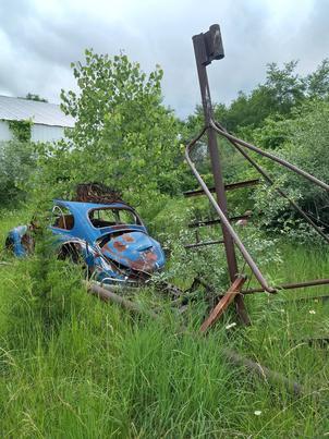 Abandoned car outside of a shack in rural MO