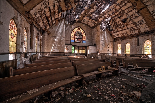 Abandoned church really on its last legs mushrooms growing out of the floor and a ceiling ready to impale the next guest 