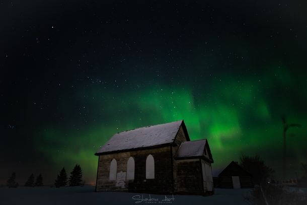 Abandoned church under the northern lights Alberta Canada