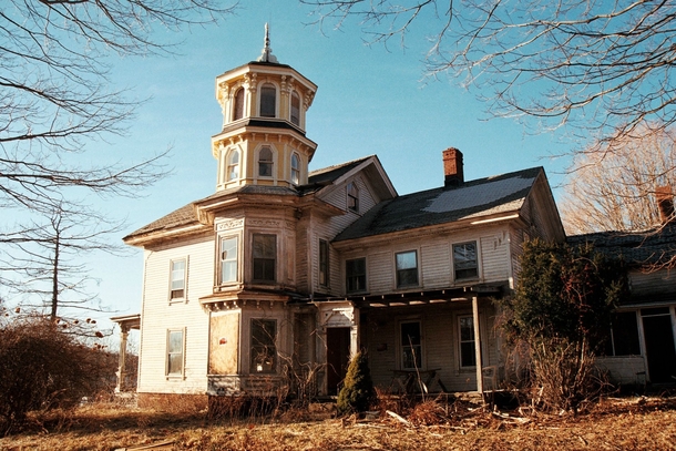 Abandoned Connecticut house with yellow tower 