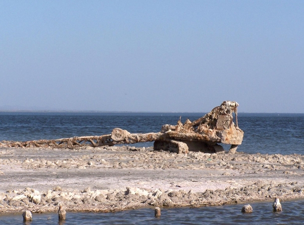 Abandoned crane rusting at the Salton sea shore in California