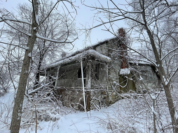 Abandoned farmhouse in snowy forest Shenandoah Valley VA