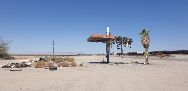 abandoned gas station with a lot of shoes