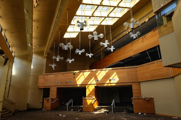 Abandoned hotel closed due to asbestos ceiling lights look like a bunch of flying drones 