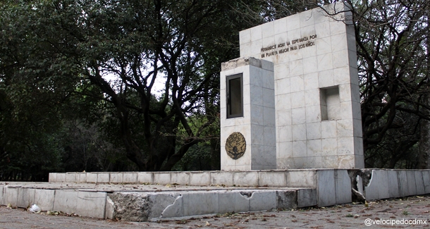 Abandoned monument in Mexico City with the inscription Here lies the hope of a better planet for the children 