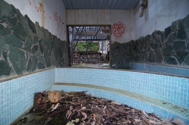 Abandoned onsen spa in Japan with graffiti of Doraemon