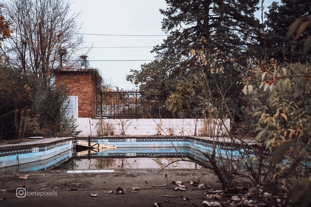 Abandoned pool by old hotel