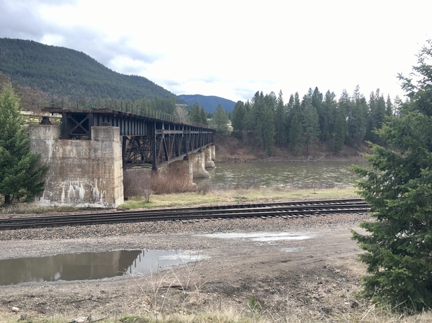 Abandoned  railroad bridge over the Clarks Fork River near St Regis Montana USA Approaches removed 