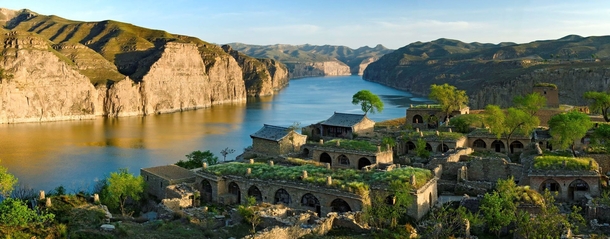 Abandoned settlement in dramatic landscape Laoniuwan Bend of the Yellow River 
