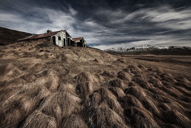Abandoned structure near the mountains in Iceland  by Bragi Ingibergsson