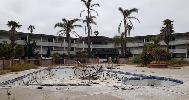 Abandoned swimming pool and condos on the harbor 