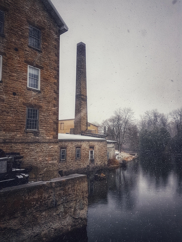 Abandoned textile mill in a snowstorm OC