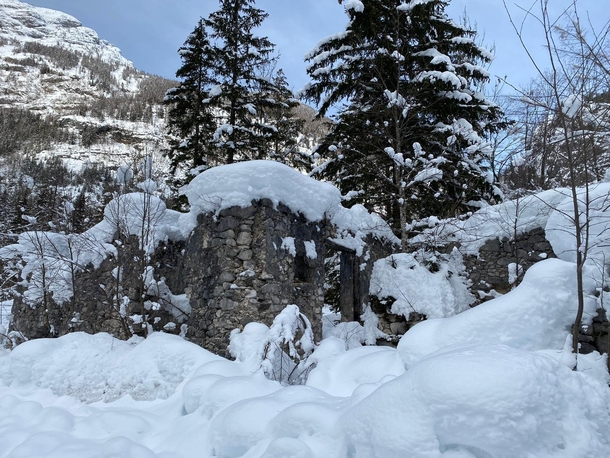 Abandoned Traditional Mountain Farm in Trenta Valley Slovenia covered in snow
