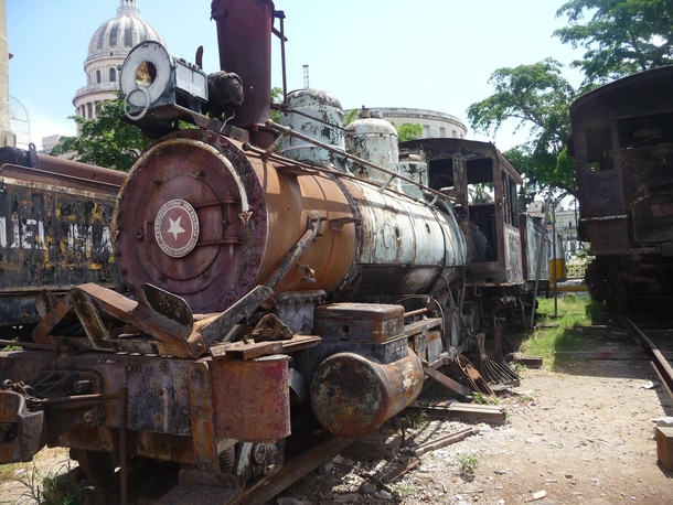 Abandoned train with El Capitolio in background Havana Cuba 