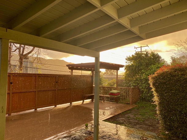 Absolutely pouring rain in sunlight right now in Los Angeles 