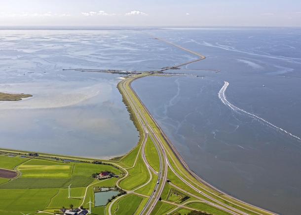 Afsluitdijk a  km dam in the Netherlands which turned the Zuiderzee sea into a freshwater lake