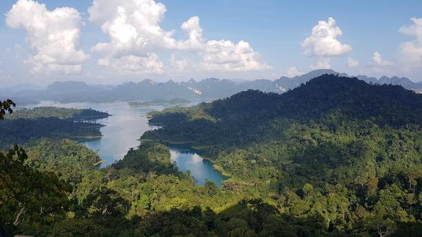 After a sweaty humid steep trek up a mountain including a rope-assisted climb at the summit we scrambled up some jagged rocks to peer over the edge and were greeted by this beautiful view Khao Sok National Park Thailand  x