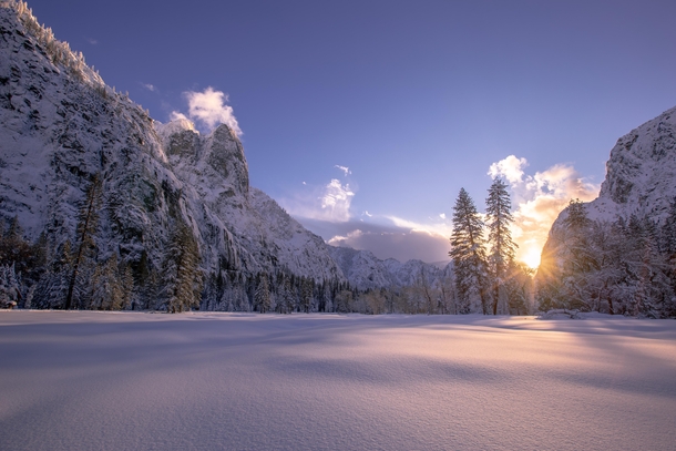After days of heavy snow falling trees amp closed roads the storm breaks revealing a snow covered Yosemite Valley 
