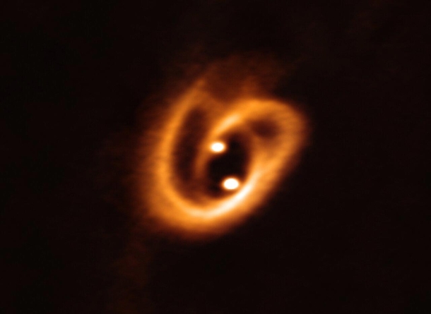 ALMA captured this unprecedented image of two circumstellar disks in which baby stars are growing feeding with material from their surrounding birth disk shedding new light on the earliest phases of the lives of stars amp help astronomers determine the co