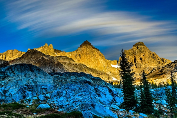 Alpenglo representing the calm before the storm on Ritter  and Banner  Peaks in Ansel Adams Wilderness California October  