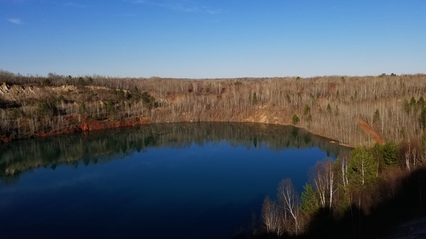 Also the abandoned highway in the woods near my house This is the old iron ore mine pit now filled up to a lake where some kids swim in the summer