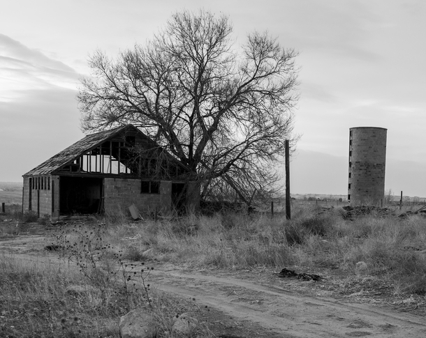 An abandoned building and silo 