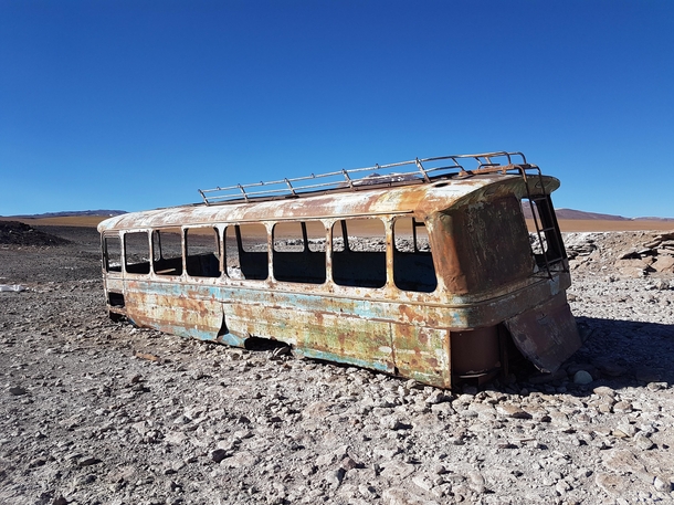 An abandoned bus covered with bullet holes in the Andes at the border between Chile and Bolivia  m of altitude - August 