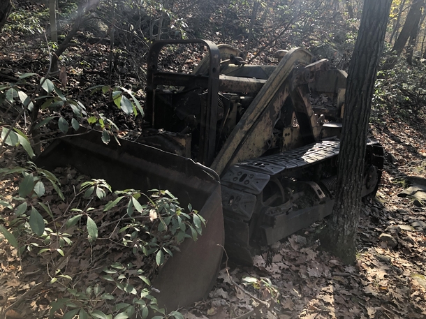 An abandoned digger in the middle of the woods