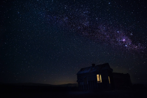 An abandoned farm house under the Milky Way 