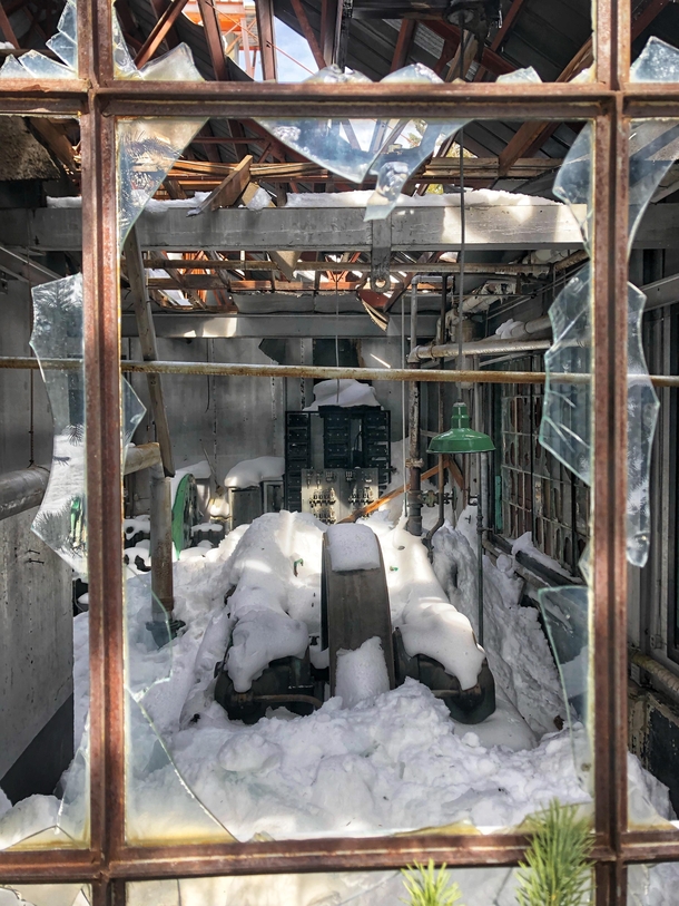 An abandoned mine building completely snowed in at Park City Utah
