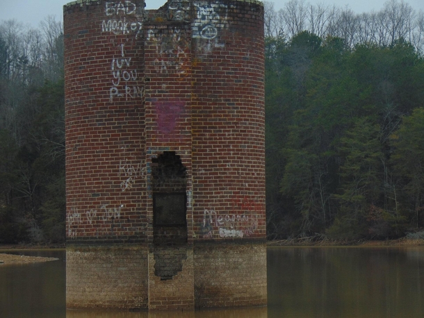 An abandoned silo partially submerged by the Tellico Lake It is one of many such silos remnants of old farms that once operated in the Little Tennessee River Valley prior to the completion of the Tellico Dam in  Vonore TN