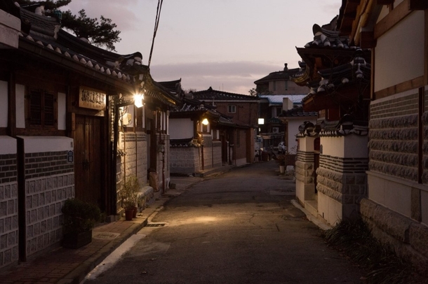 An alley lit during the evening in the historic Bukchon Hanok Village Jongno District Seoul South Korea 