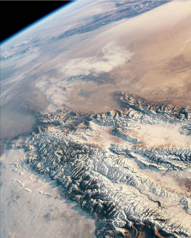 An astronaut in the international space station took this highly oblique photograph of the eastern Tien shan and Taklimakan desert in Central Asia