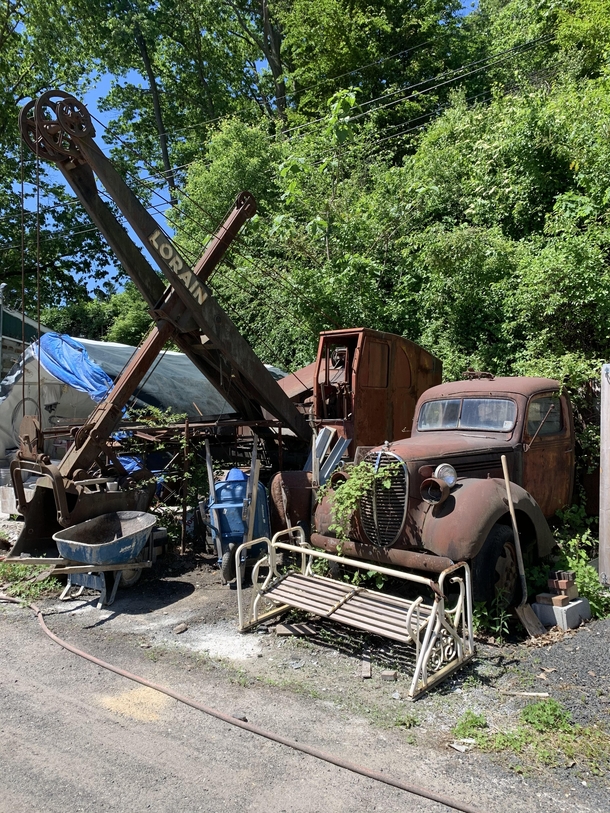 An old ford pick up truck and a old excavator at my familys old quarry where they keep all of their stuff Never asked whos truck it was but Im pretty sure its my grandfathers and its been there my entire life Ill post more pictures if anyone wants them