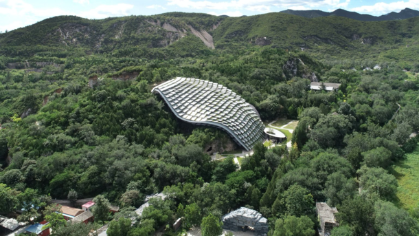 An undulating shelter has been constructed over the Zhoukoudian Peking Man cave a historic site in China that is home to ancient human fossils in an effort to protect it from weathering