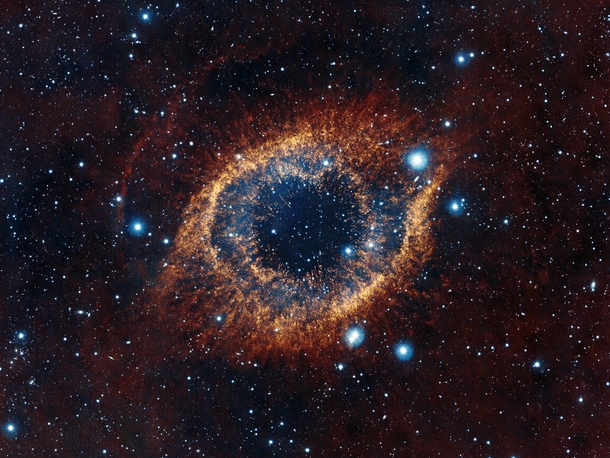 An Unusual View of The Helix Nebula aka The Eye of God Captured by ESOs Visible and Infrared Survey Telescope for Astronomy VISTA 