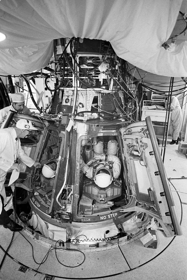 Astronauts David Scott and Neil Armstrong inserted into the Gemini- spacecraft prior to liftoff  March  