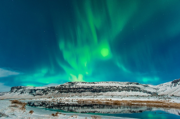 Aurora Borealis over a lake in north Iceland 