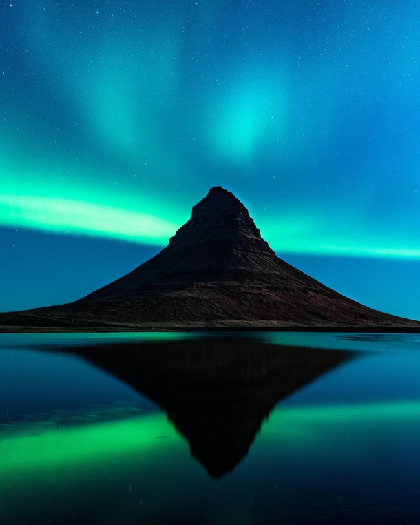 Aurora dancing over Kirkjufell Iceland 