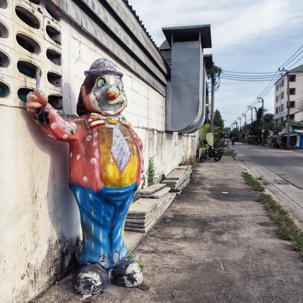 Bando the Clown in front of a defunct Bangkok toy factory