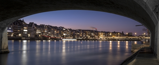 Basel under the Bridge - the view of Basel Switzerland from along the Rhine  by Frederic Huber