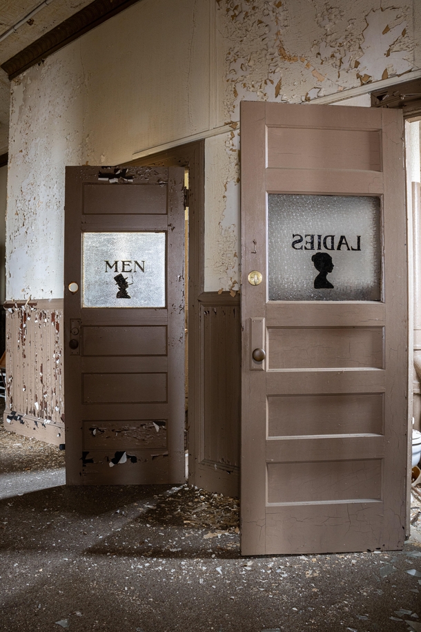 Bathroom doors in an abandoned office building 