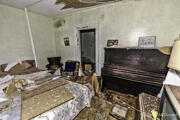 Bedroom and music room of a time capsule abandoned farmhouse chock full of furniture and possessions NW of Toronto