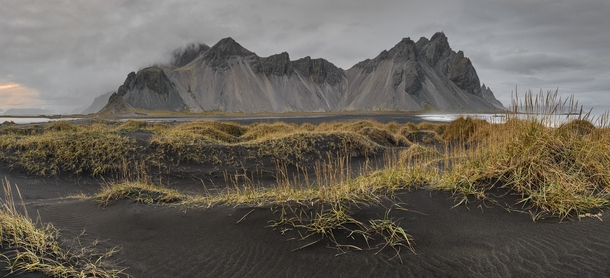 Black volcanic sand dunes on the beach at Stokness Iceland By Sergey Aleshchenko 