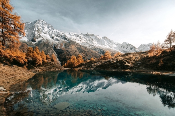 Blue Lake in Arolla during autumn Always great with these colors Switzerland  IG daviddunand_photography